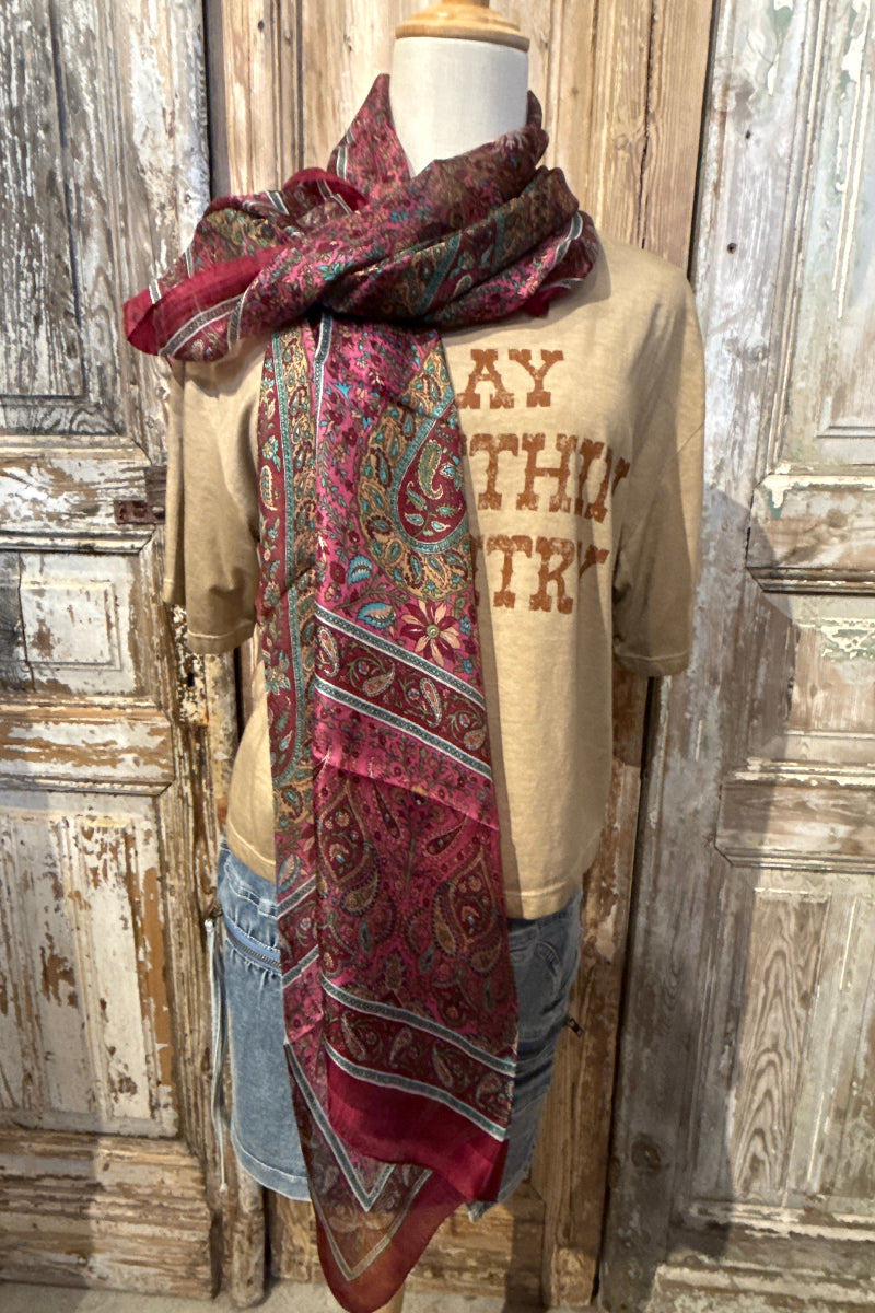 Trestles Clothing Company silk boho scarf in vibrant magenta and paisley prints draped over a mannequin